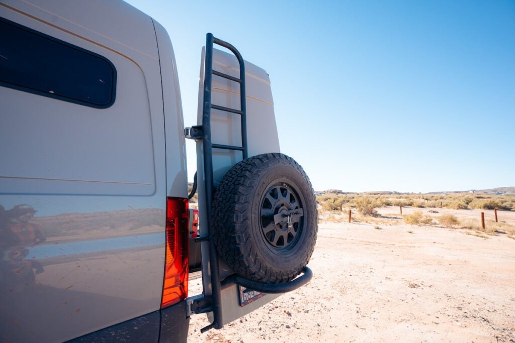 Owl Vans Tire + Ladder Combo installed on the back of a Sprinter van