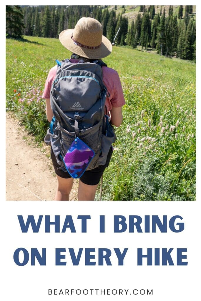 Kristen Bor hiking at Alta Ski area in summer with a gray backpack on. Text reads What I bring on every hike.