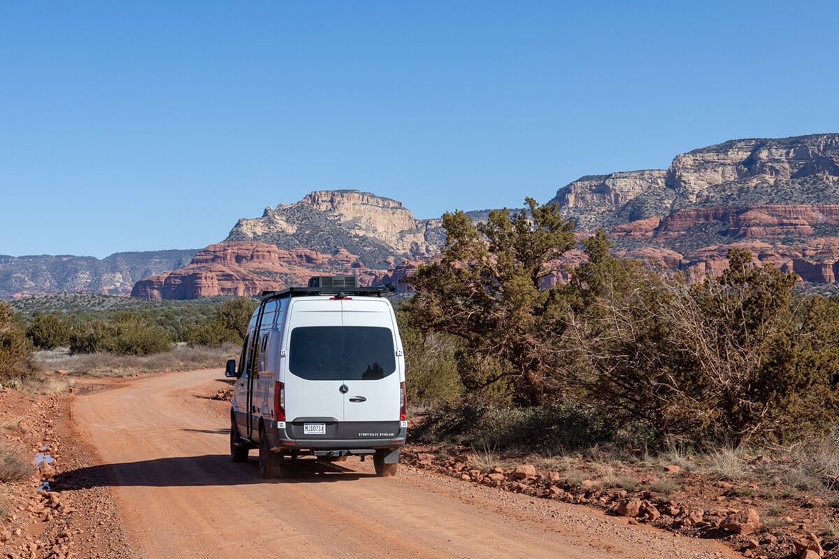 The Storyteller Overland Classic MODE AWD van driving off-road on a dirt road in Sedona, Arizona