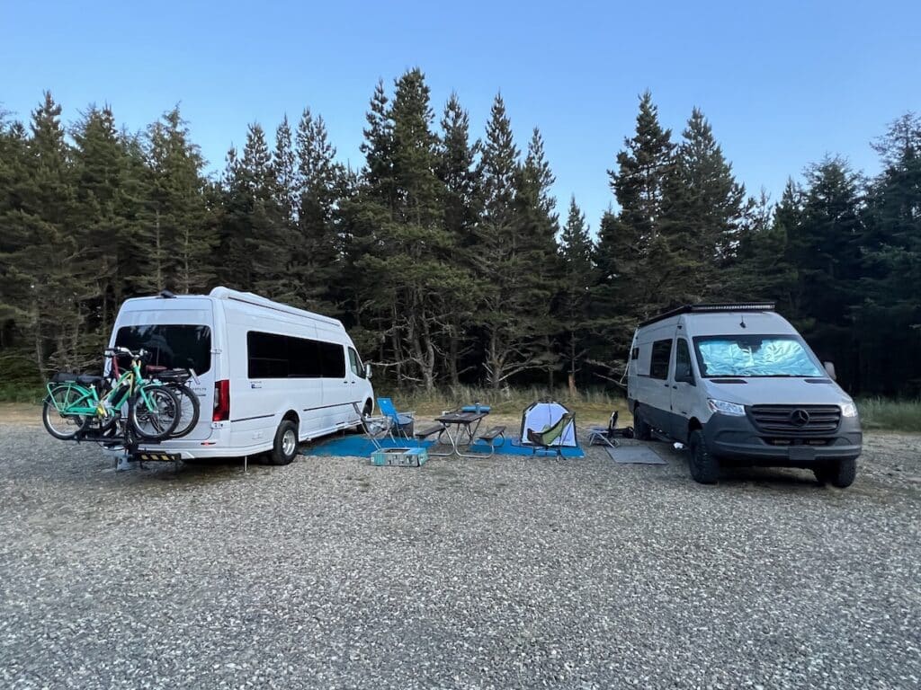 Two Sprinter vans parked side by side at the lamp camp campground in Long Beach Washington