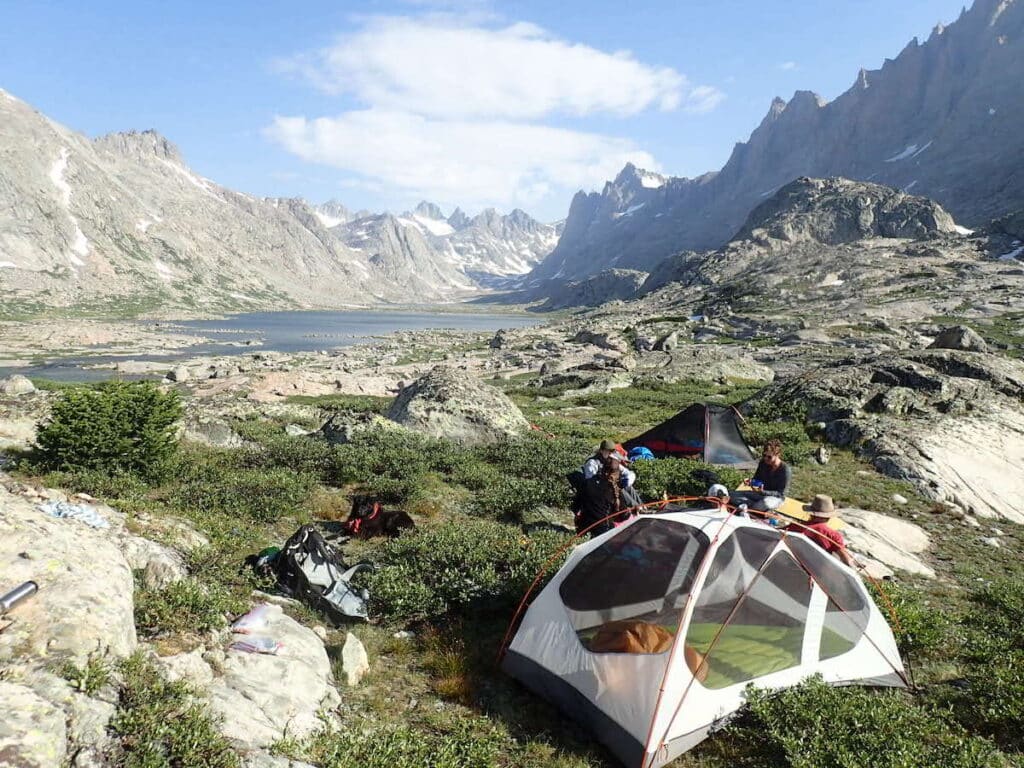 Backpackers set up a tent near Titcomb Basin the Wind River Range Wyoming