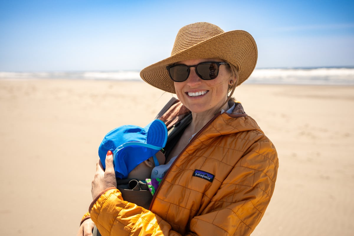 Kristen Bor holding baby on the beach in Long Beach Washington