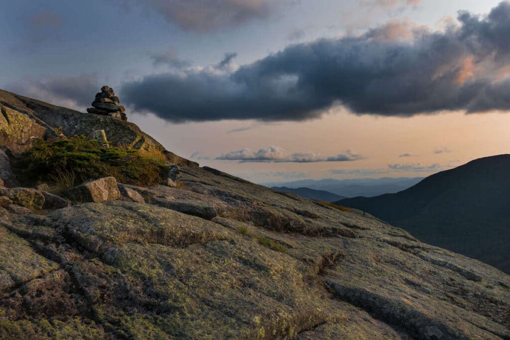 Rock cairn on top of Haystack Mountain in the Adirondacks at sunset
