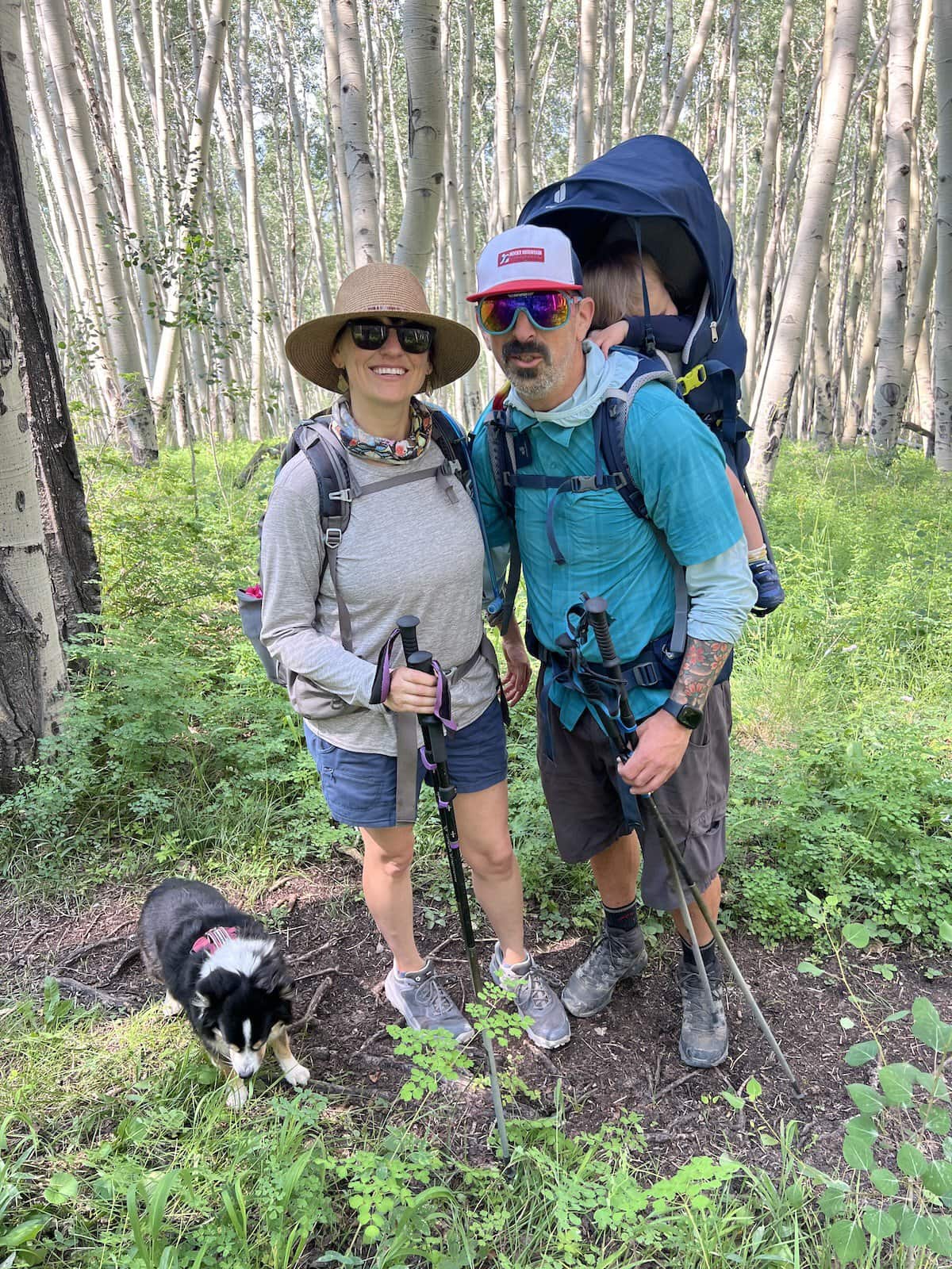 Couple hiking with baby in a backpack