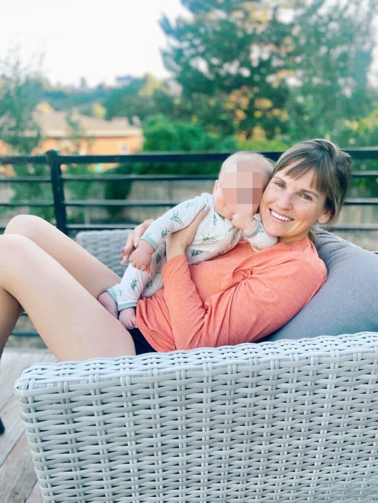 Woman with baby in a backyard