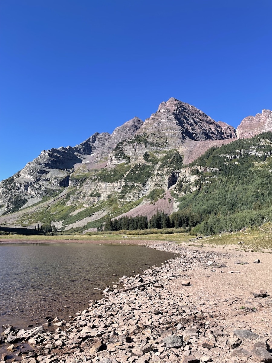View of the Maroon Bells from Crater Lake on the Four Pass Loop trail.
