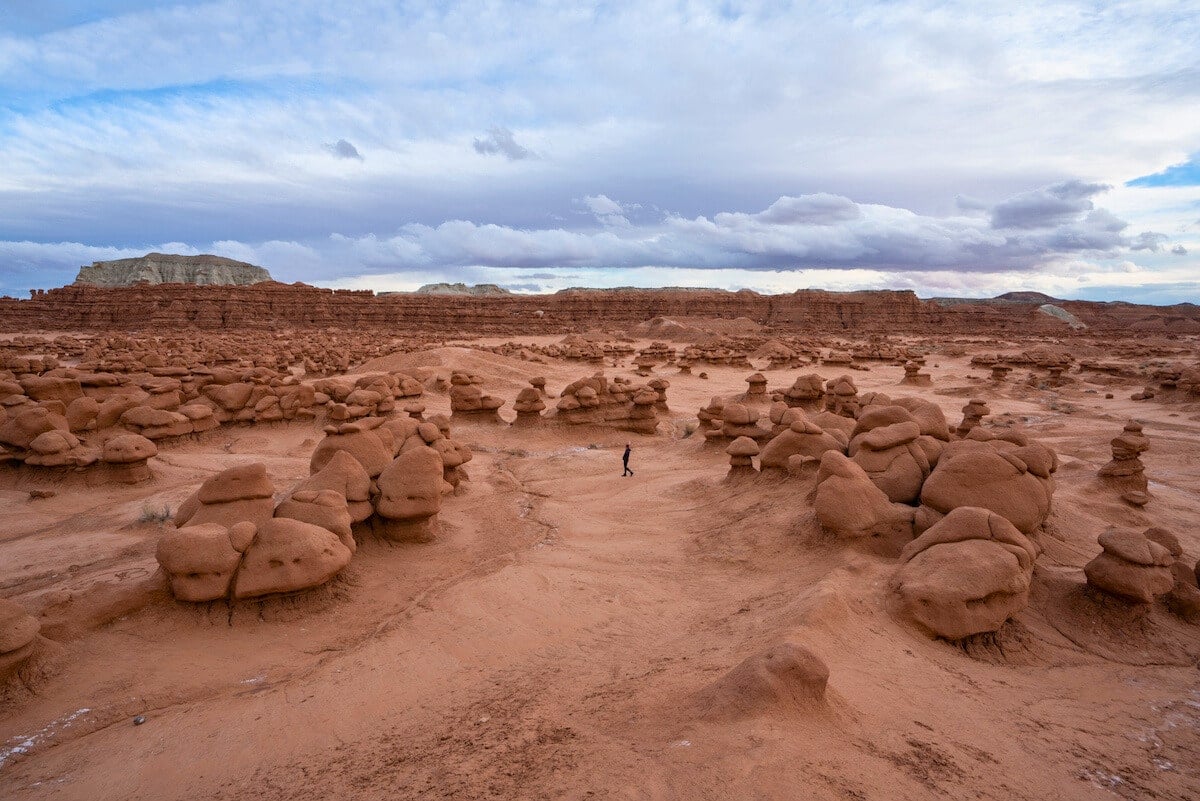 Person walking in the Valley of Goblins in Goblin Valley State Park in Utah