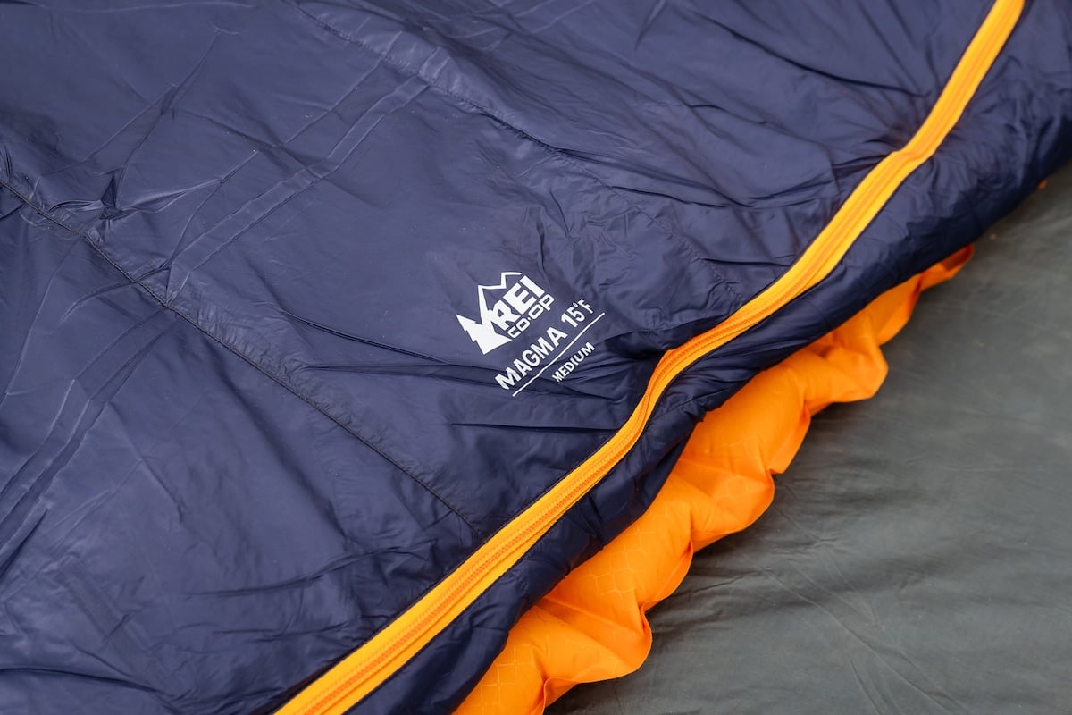 Close up shot of the REI logo on the Magma sleeping bag in a size medium