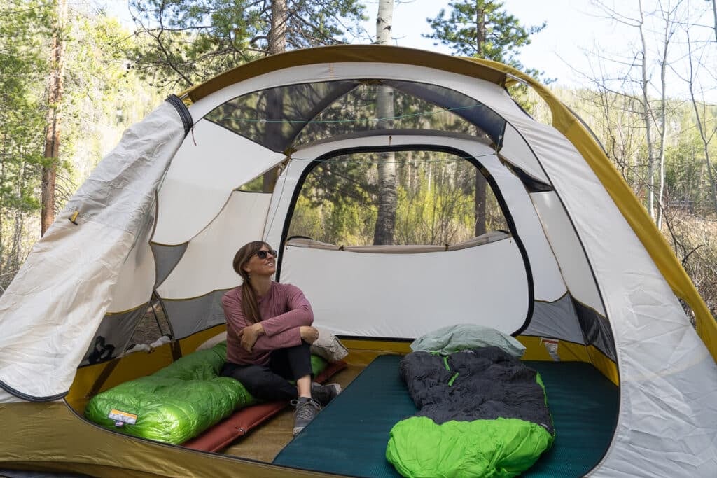 Kristen Bor sitting inside the REI Base Camp 4 Tent