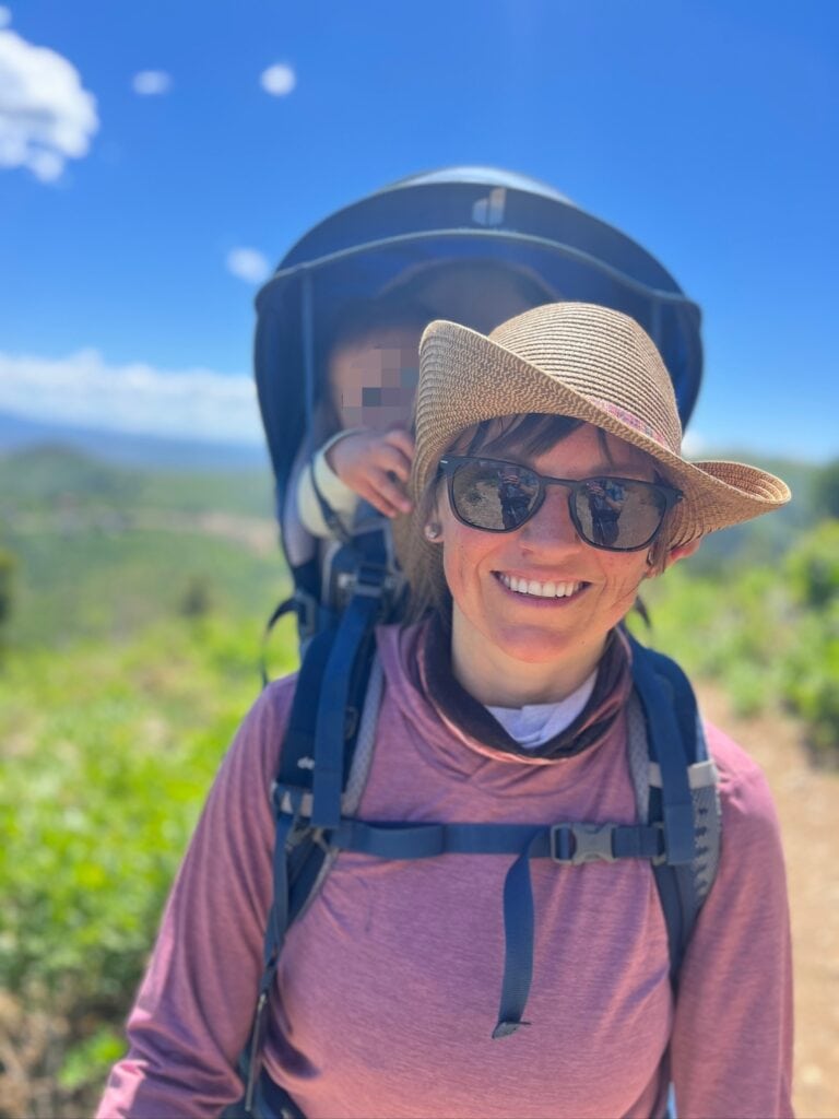 Kristen Bor carrying her baby in a backpack