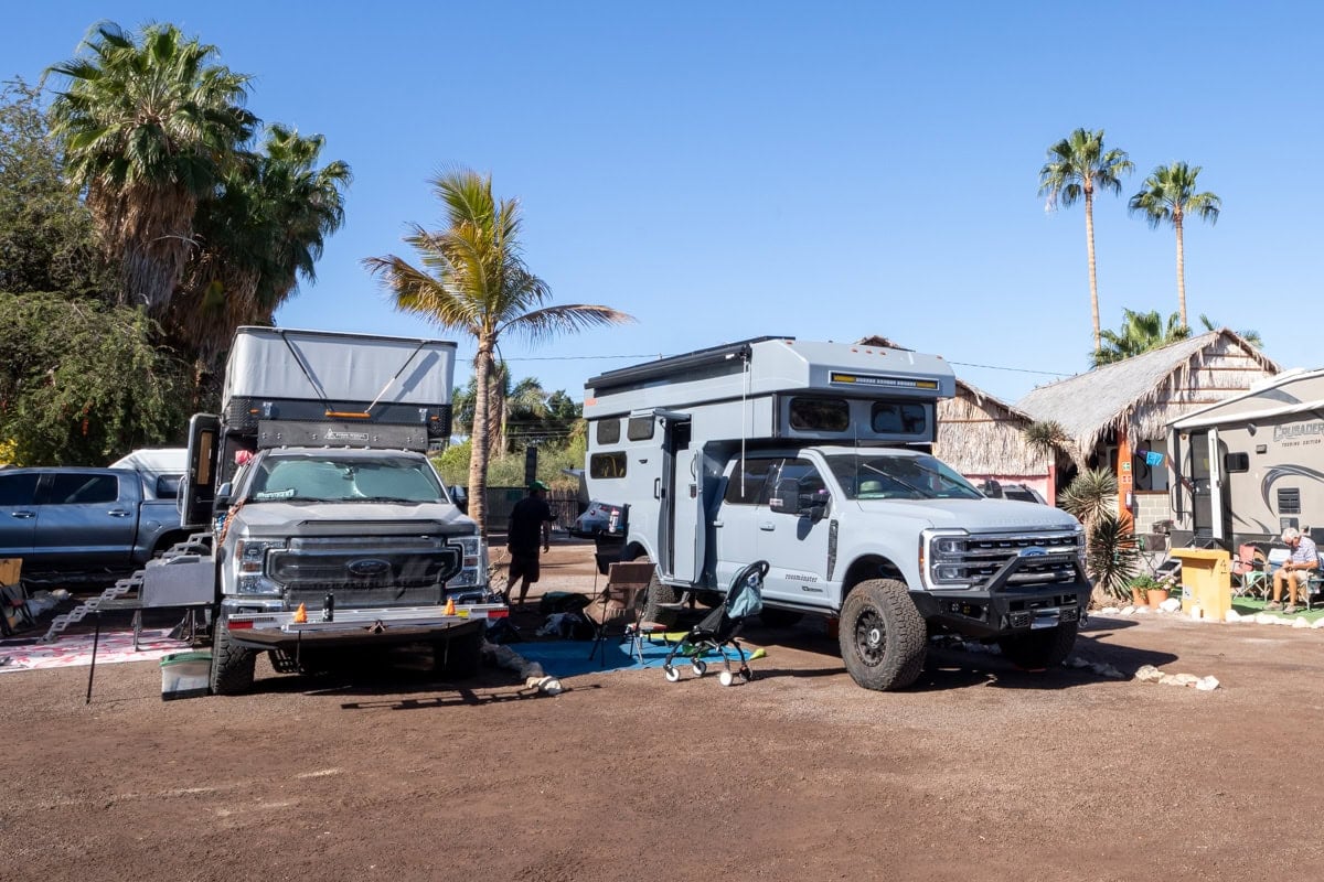 Rossmonster Baja Trail LX parked at an RV park next to a Four Wheel Camper