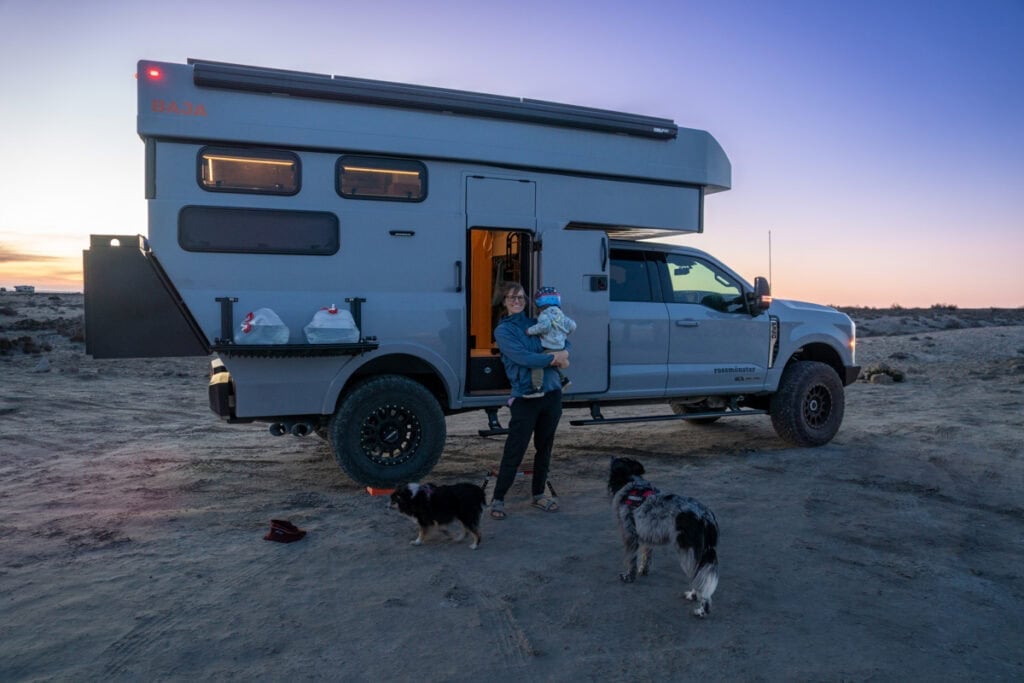 Kristen Bor and her son standing outside the Rossmonster Baja Trail LX at sunset