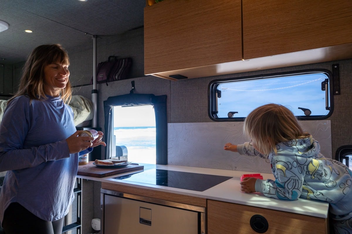 Kristen Bor and her son next to the kitchen counter in the Rossmonster Baja Trail LX