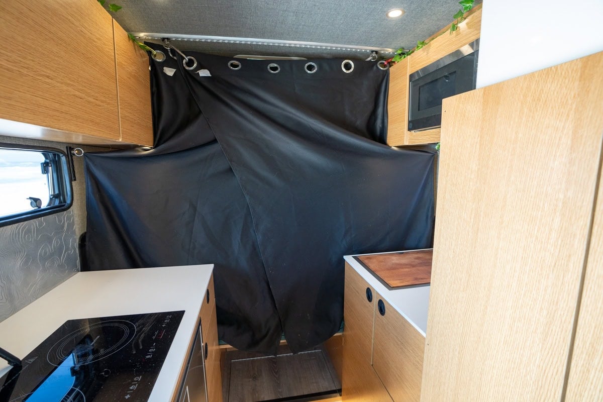 Black out curtains hanging from the ceiling in the Rossmonster Baja LX