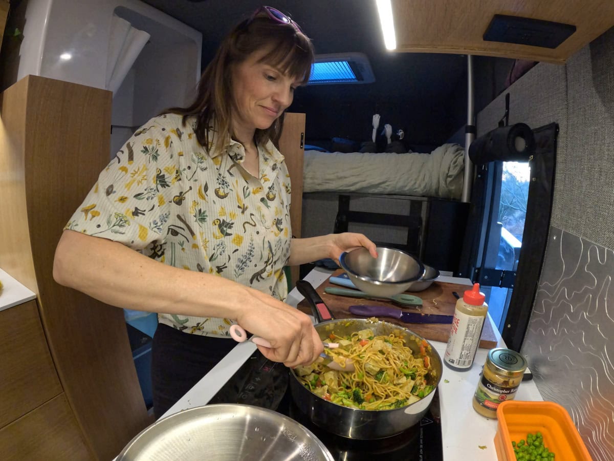 Kristen Bor cooking on the induction stove in the Rossmonster Baja LX