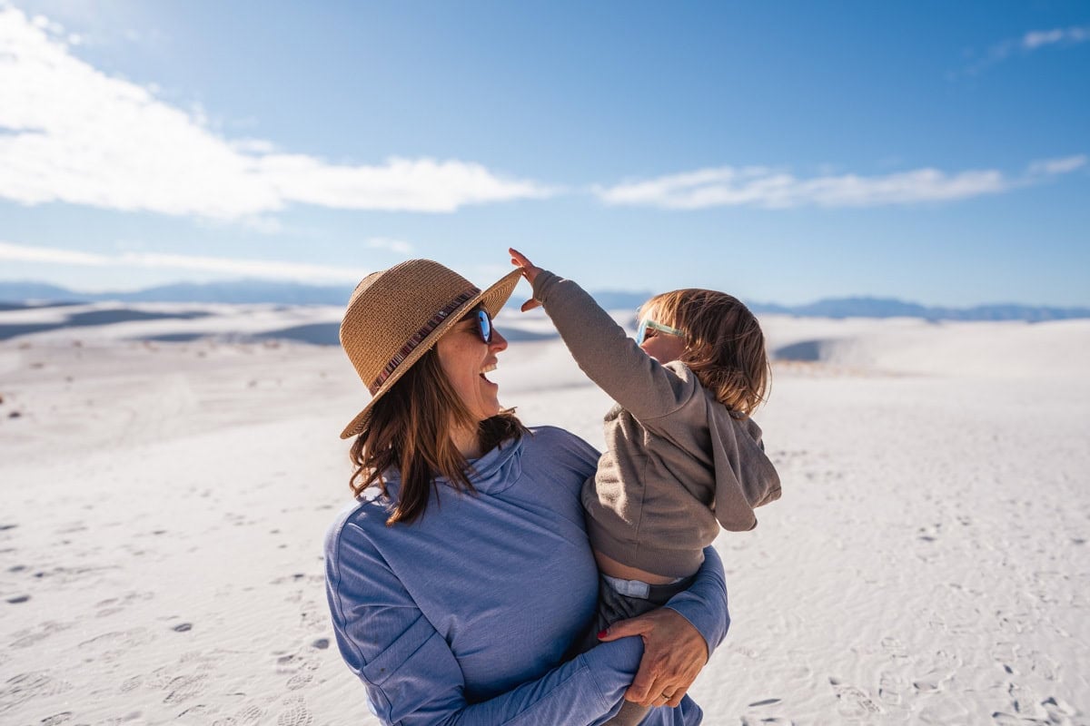 Kristen Bor holding her son in White Sands National Park