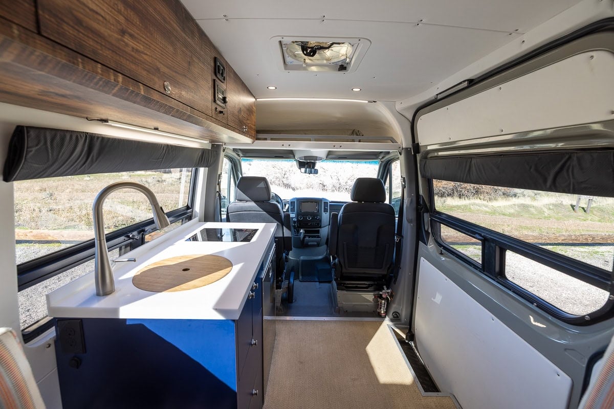 The inside of a Sprinter Van looking up towards the front cab